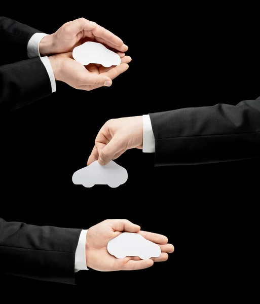 Male hands in suit holding the white paper car — Stock Photo, Image