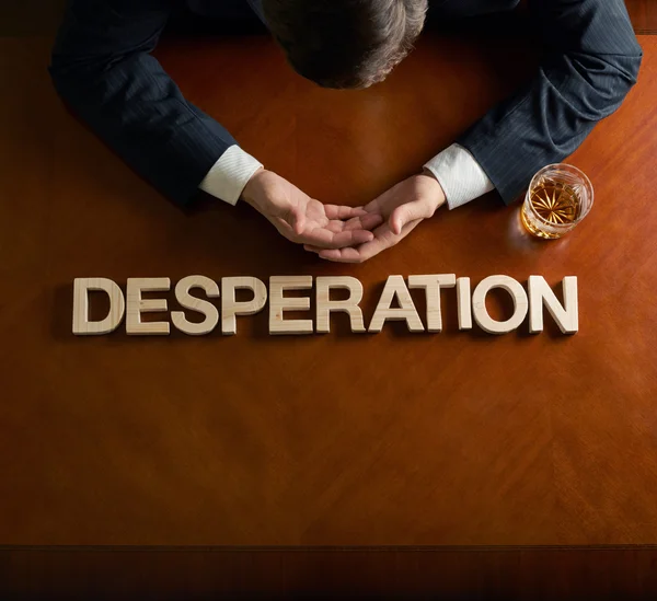 Devastated man and word desperation — Stock Photo, Image