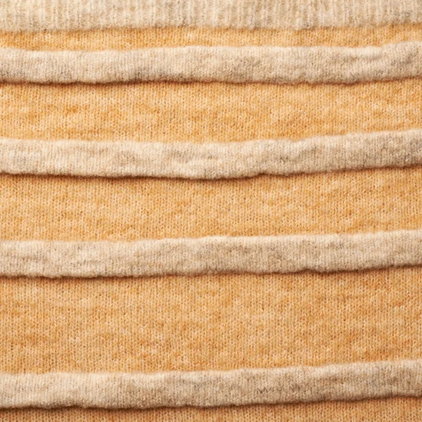 Knitted beige sweater fragment — Stock Photo, Image