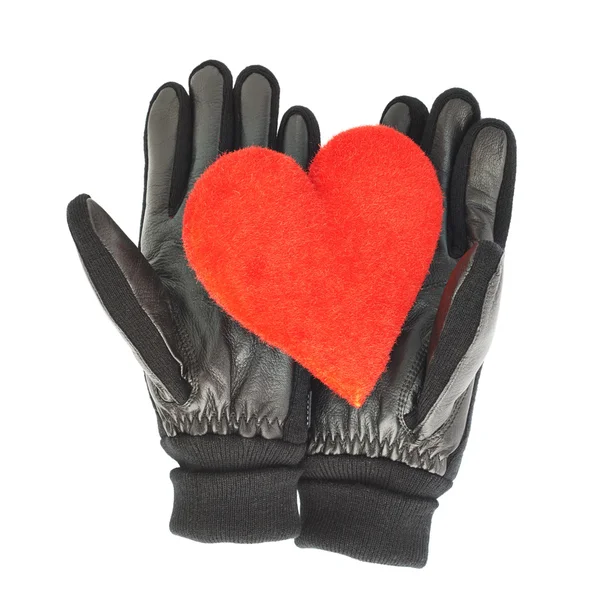 Corazón rojo en guantes de cuero negro — Foto de Stock