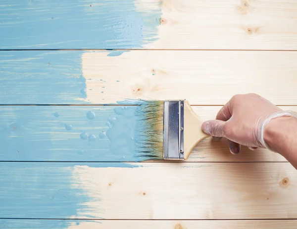 Process of painting wooden boards — Stock Photo, Image