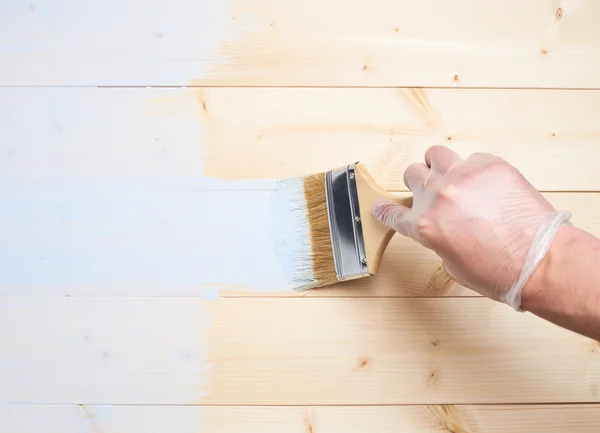 Process of painting wooden boards — Stock Photo, Image