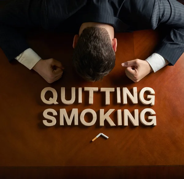 Phrase Quitting Smoking and devastated man composition — Stock Photo, Image