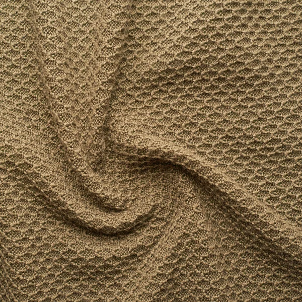 Knitted beige cloth material fragment — Stock Photo, Image