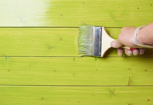 Process of painting wooden boards — Stock Photo, Image