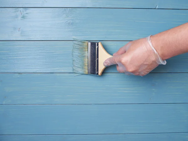 Process of painting wooden boards — Stock Photo, Image