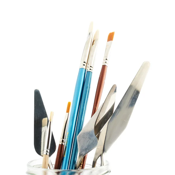 Different brushes and knives — Stock Photo, Image