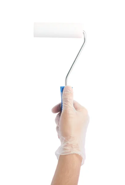 Hand holding a new paint roller — Stock Photo, Image