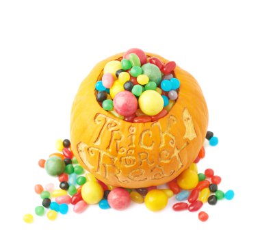 Trick or treat pumpkin filled with candy sweets clipart