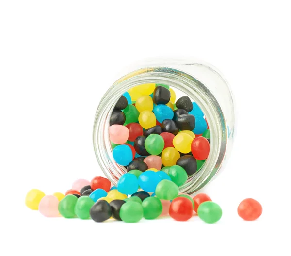 Candy ball sweets falling out of a jar Royalty Free Stock Photos