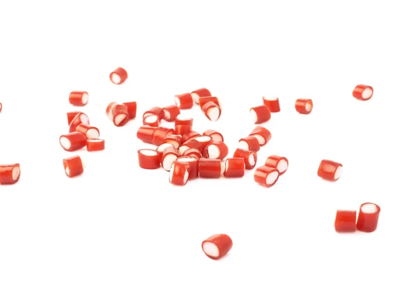 Multiple red candy sweets spilled over the surface — Stock Photo, Image