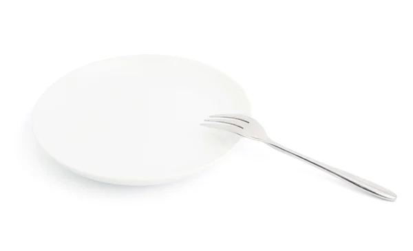 Coltello e forchetta sul piatto isolato — Foto Stock
