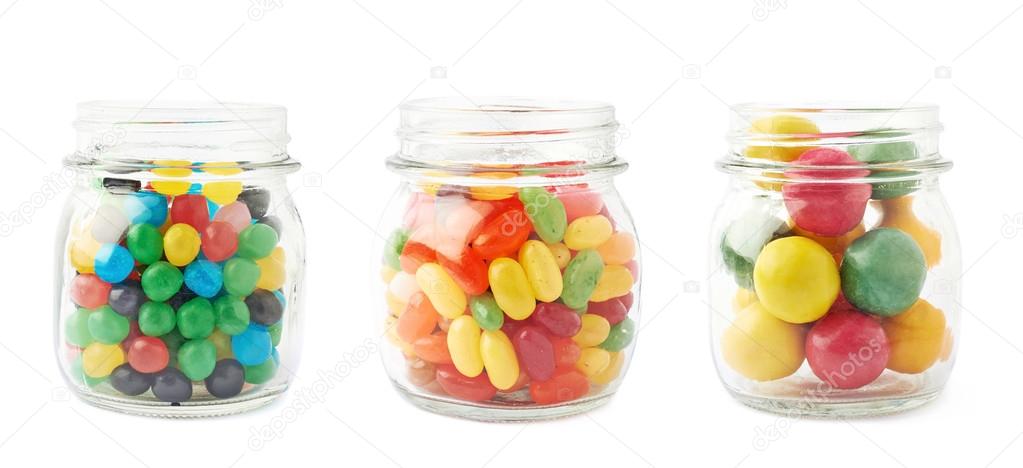 Three jars full of different kinds of candies
