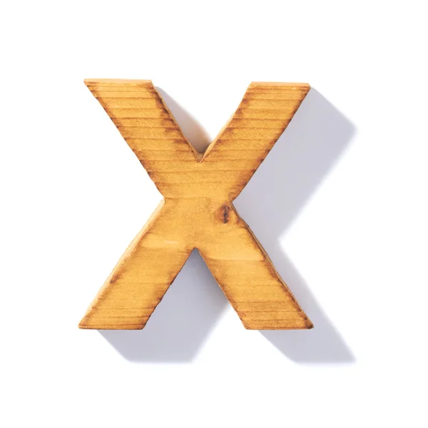 Бурая деревянная буква X — стоковое фото