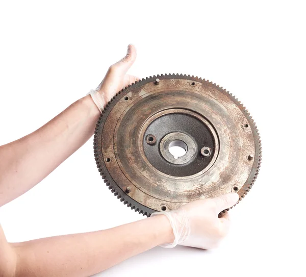 Hands holding engine's fragment — Stock Photo, Image