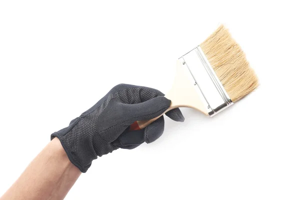 Hand holding a paint brush — Stock Photo, Image