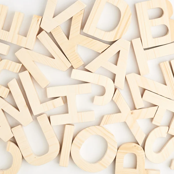 Surface covered with wooden letters — Stock Photo, Image