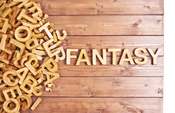 Word fantasy made with wooden letters — Stock Photo, Image