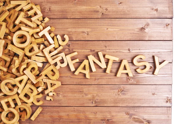 Slovo fantasy s dřevěnými dopisy — Stock fotografie
