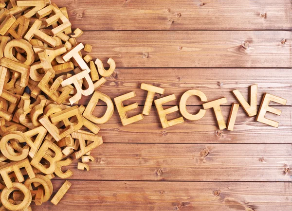 Word detective gemaakt met houten letters — Stockfoto