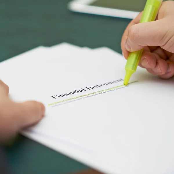 Marking words in a financial instrument definition — Stock Photo, Image