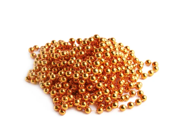 Pile of golden beads on a string — Stock Photo, Image