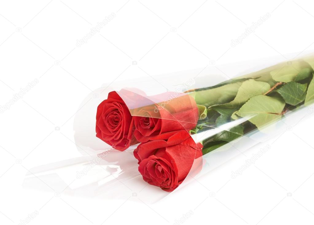 Three red roses in a wrapping