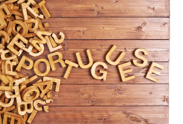 Word portuguese made with wooden letters — Stock Photo, Image