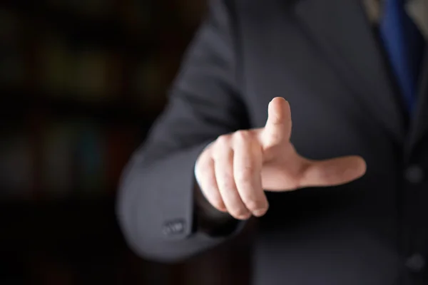 Man i ett business suit pekande finger — Stockfoto