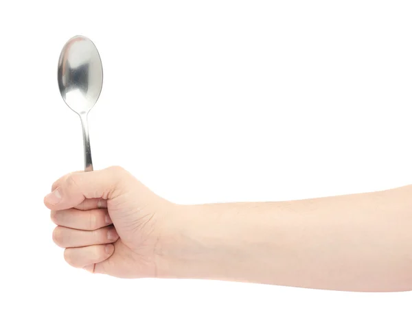 Male hand holding an empty spoon — Stock Photo, Image