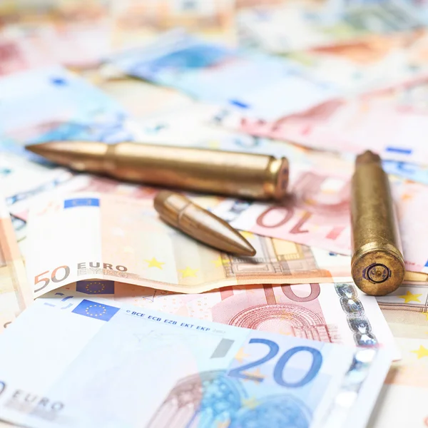 Few bullets over the pile of money
