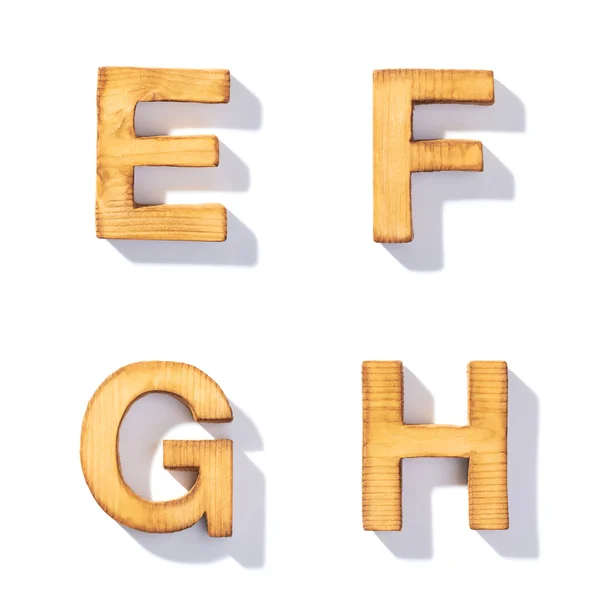 Wooden letters E, F, G, H — Stock Photo, Image
