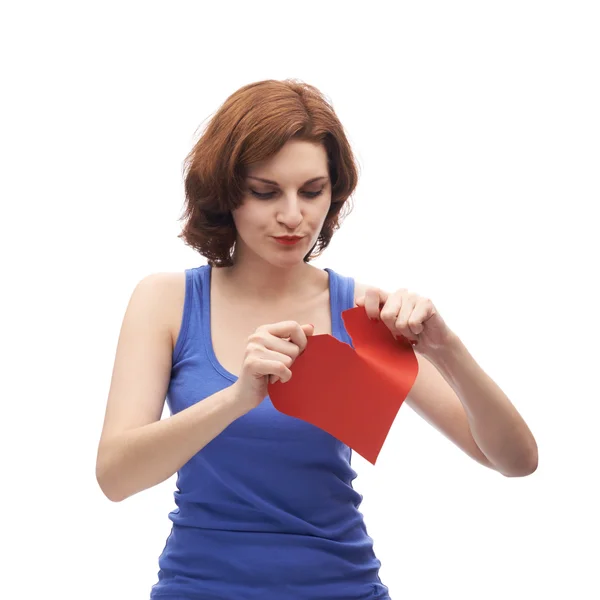 Woman  tearing red heart — Stock Photo, Image