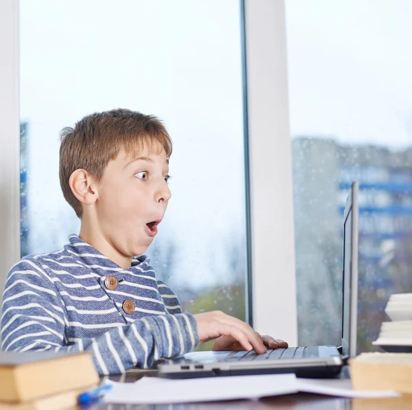 Boy  playing with the notebook — Stock Photo, Image