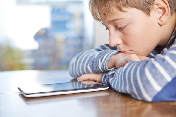 Boy  looking at the tablet pad device — Stock Photo, Image