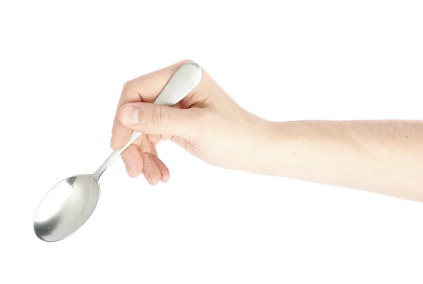 Male hand holding an empty spoon — Stock Photo, Image