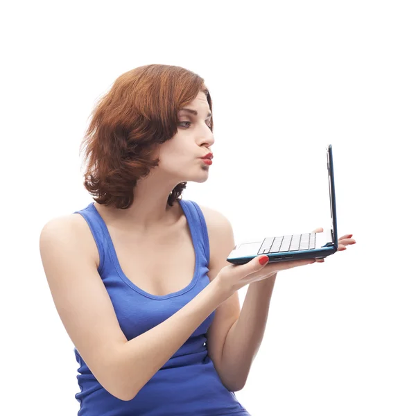 Woman  sending air kiss to  notebook — Stock Photo, Image