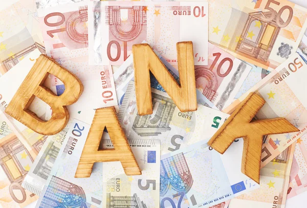 Word banka para yığını üzerinde — Stok fotoğraf