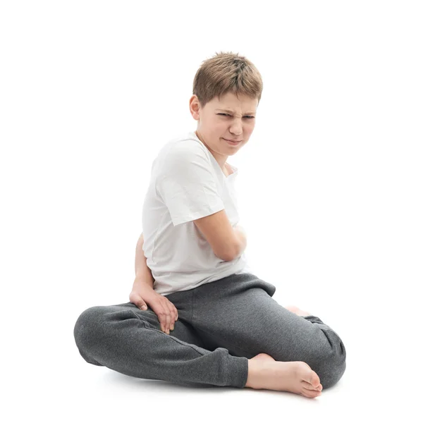 Junge dehnt sich oder macht Yoga — Stockfoto