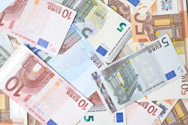 Superficie cubierta con billetes de banco en euros —  Fotos de Stock