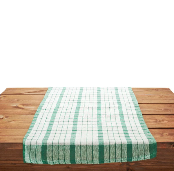 Полотенце над деревянным столом — стоковое фото