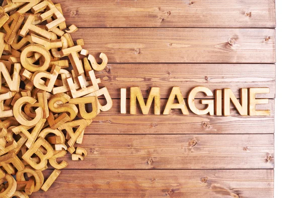 Palavra imaginar feito com letras de madeira — Fotografia de Stock