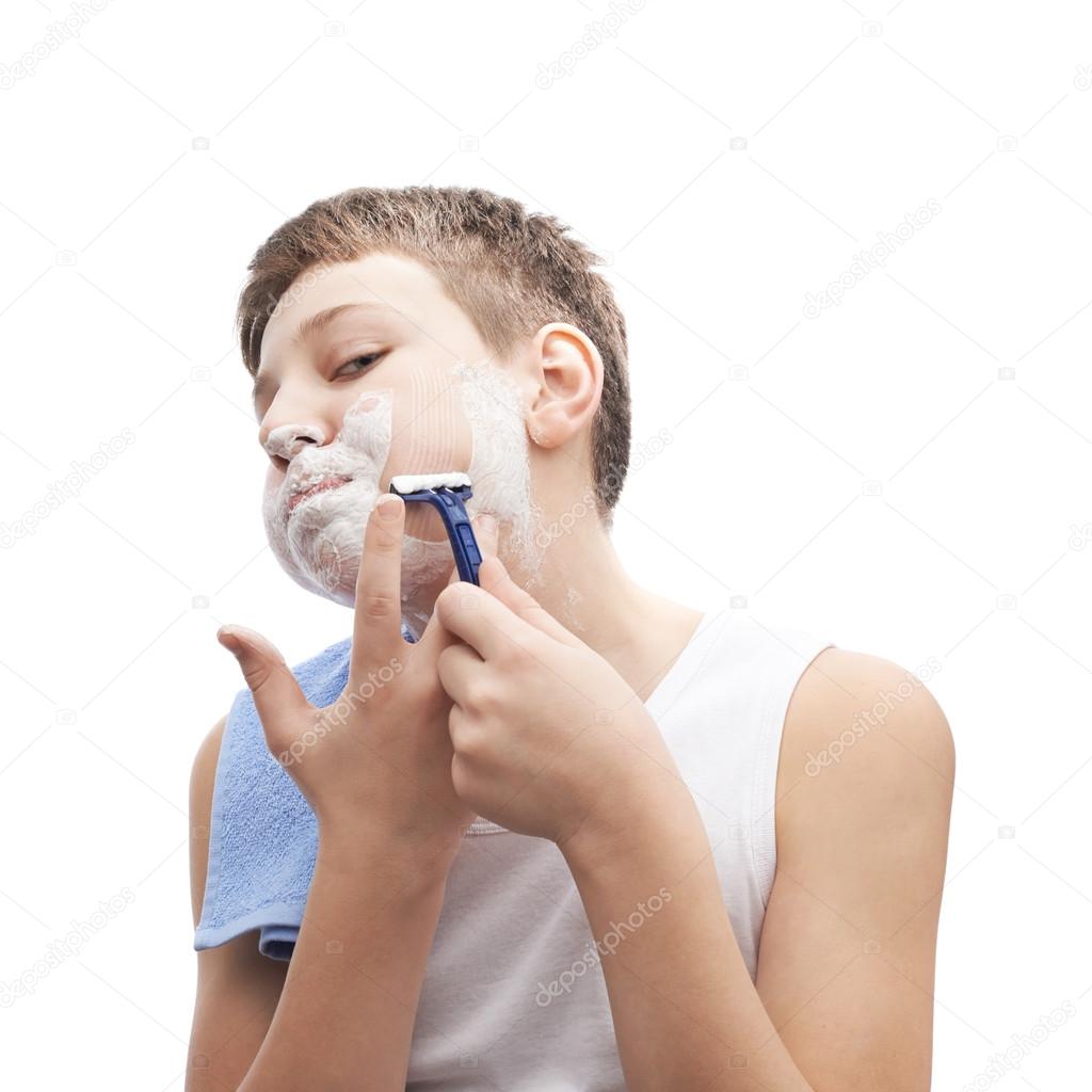 Young boy   in process of shaving