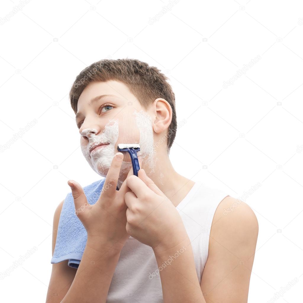 Young boy   in process of shaving