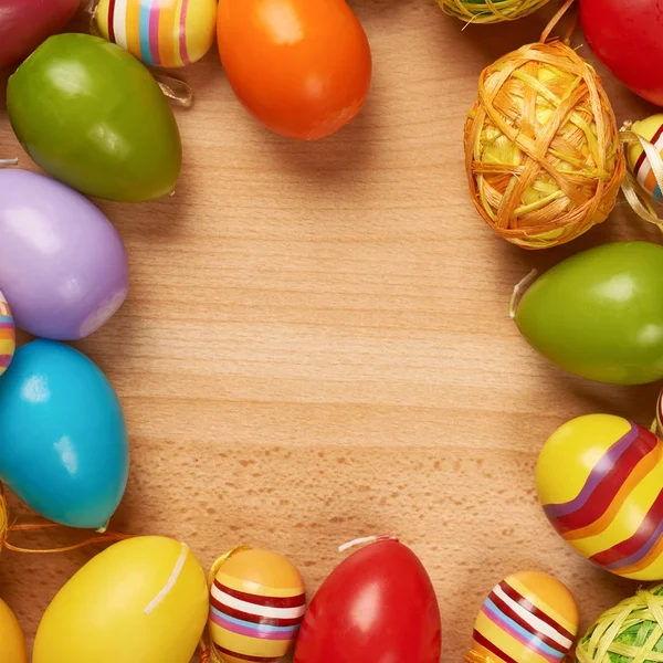 Easter eggs over wooden surface — Stock Photo, Image