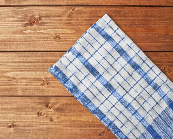 Toalha de mesa ou toalha sobre a mesa de madeira — Fotografia de Stock