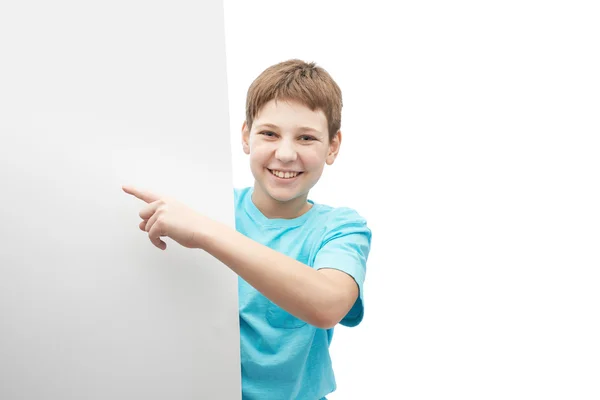 Smiling oung boy with a sheet of paper Royalty Free Stock Images