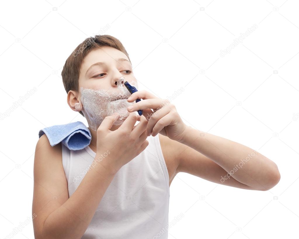 Young boy in process of shaving