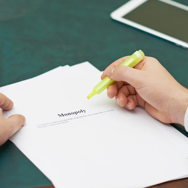 Marking words in a monopoly definition — Stock Photo, Image