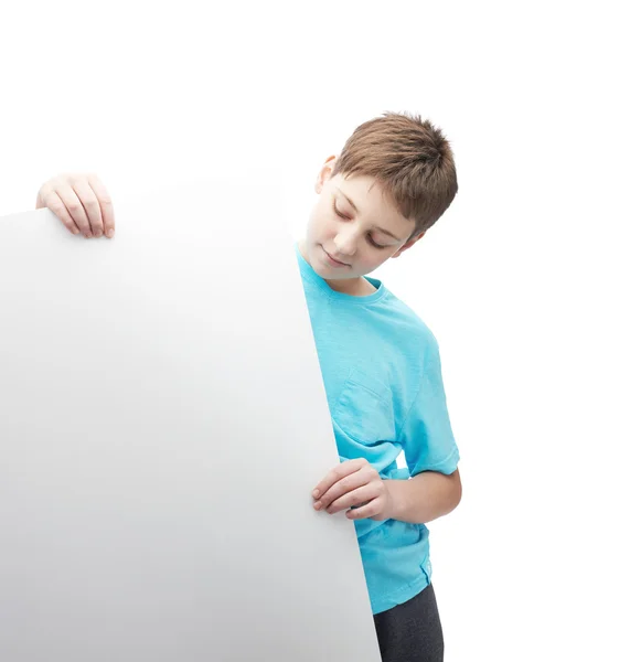 Smiling young boy with a sheet of paper — Stock Photo, Image